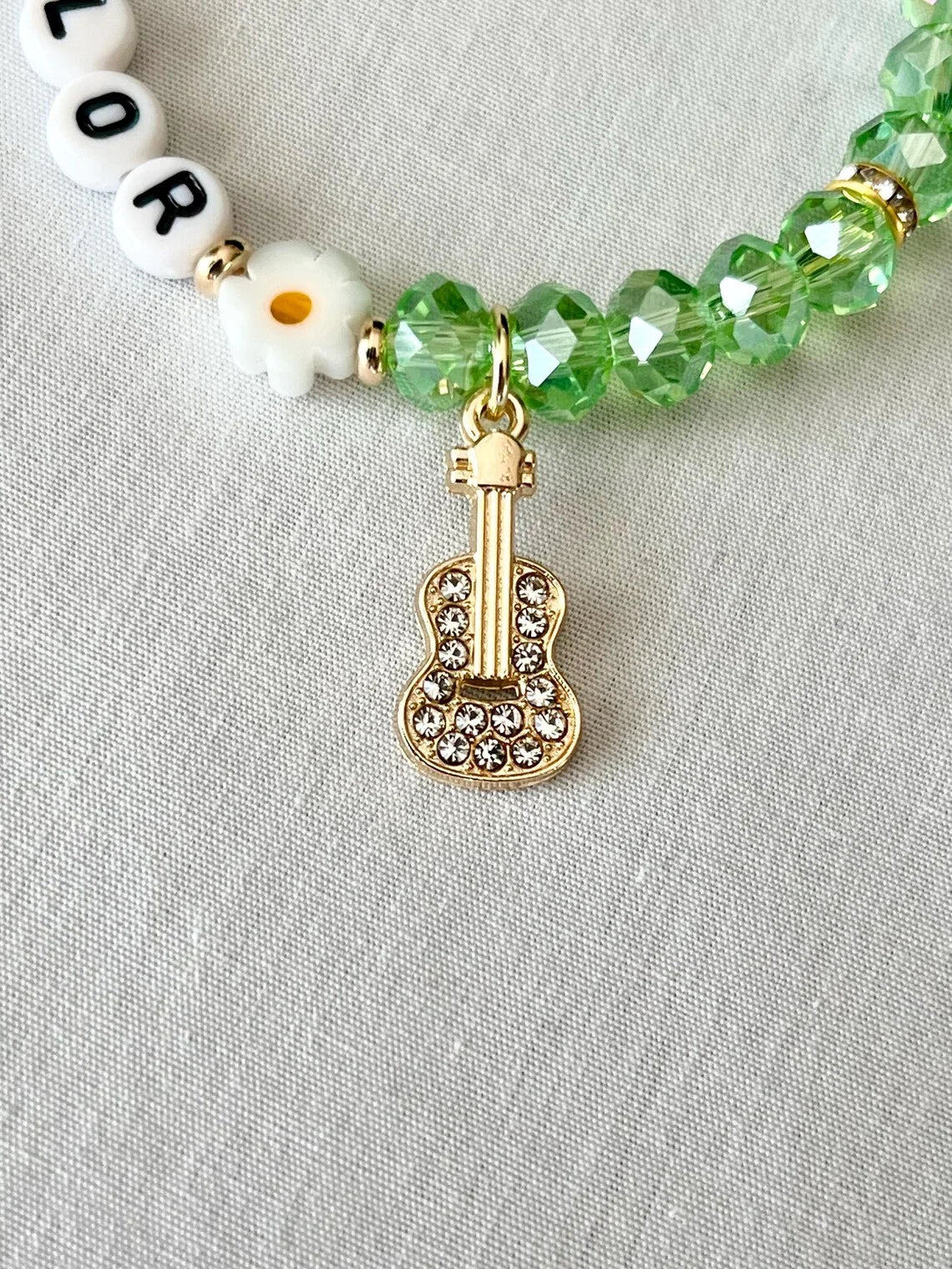 Debut-Era Inspired Friendship Bracelet – Green Crystal Beads & Guitar Charm | Aesthetic Fan Gift